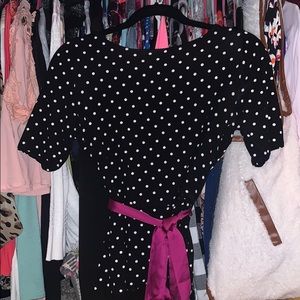 Black shirt with white polka dot.